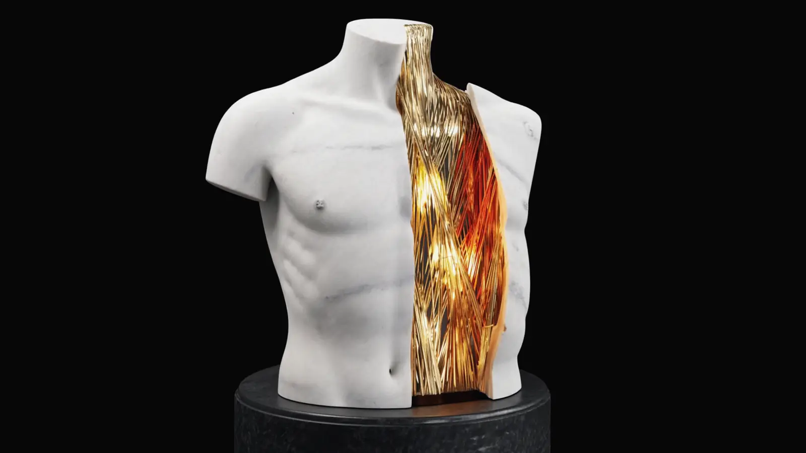 A marble torso opened along a seam, gold and ember light inside the hollow stone
